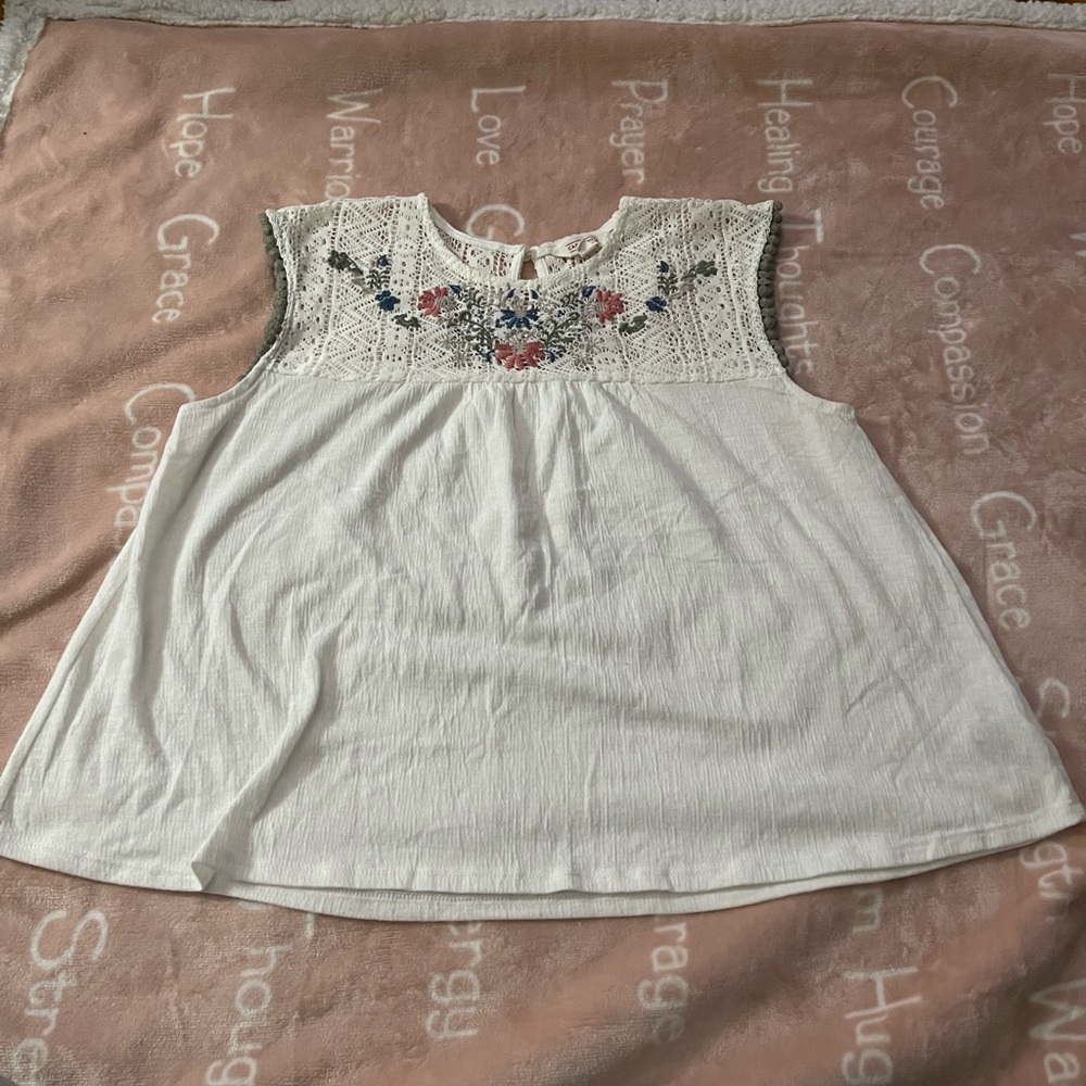 White Sleeveless Top with Embroidered Floral Design